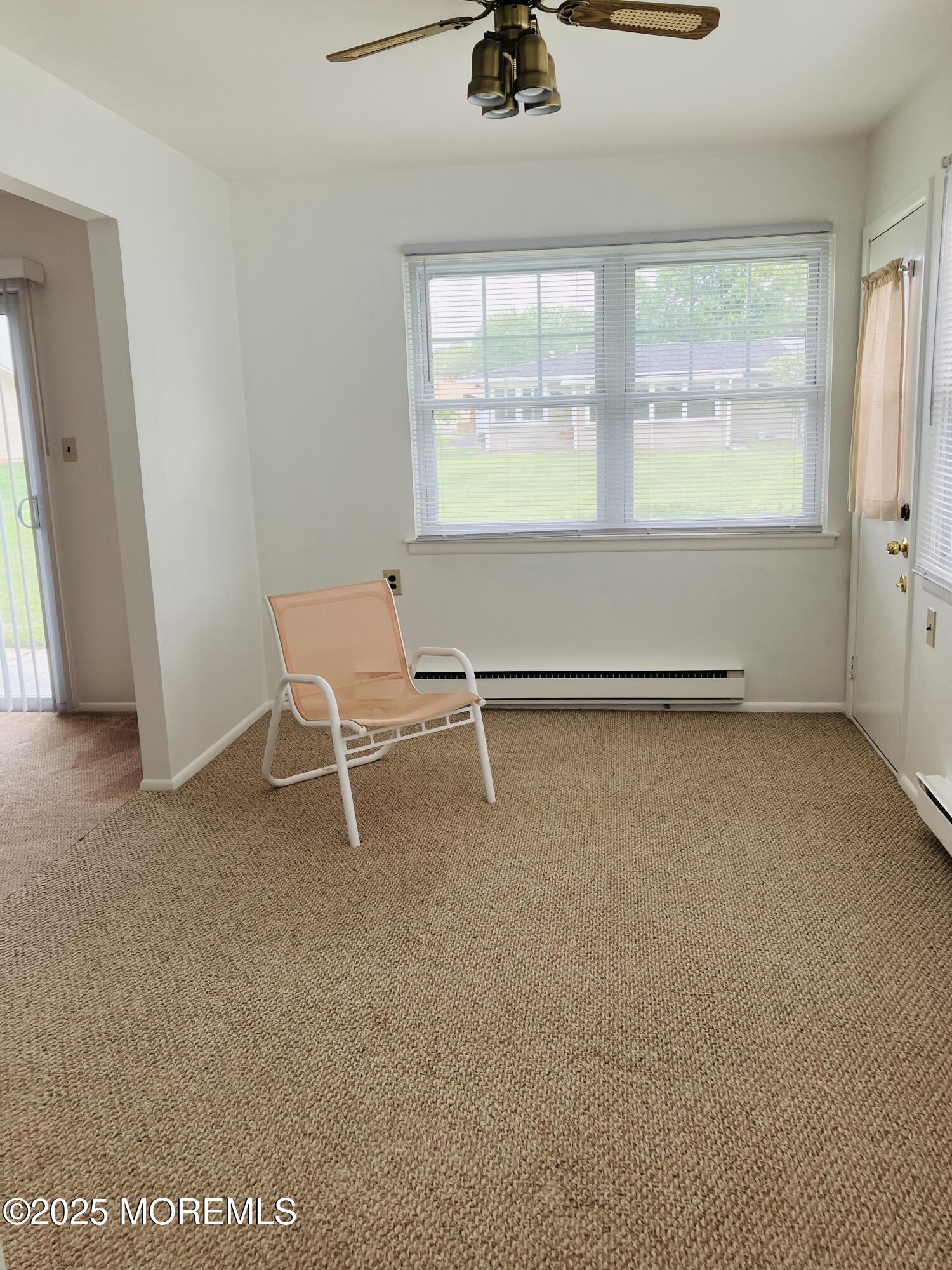 Undisclosed Address Brick, NJ 08724 - Photo 5 of 13 a view of an empty room with a window