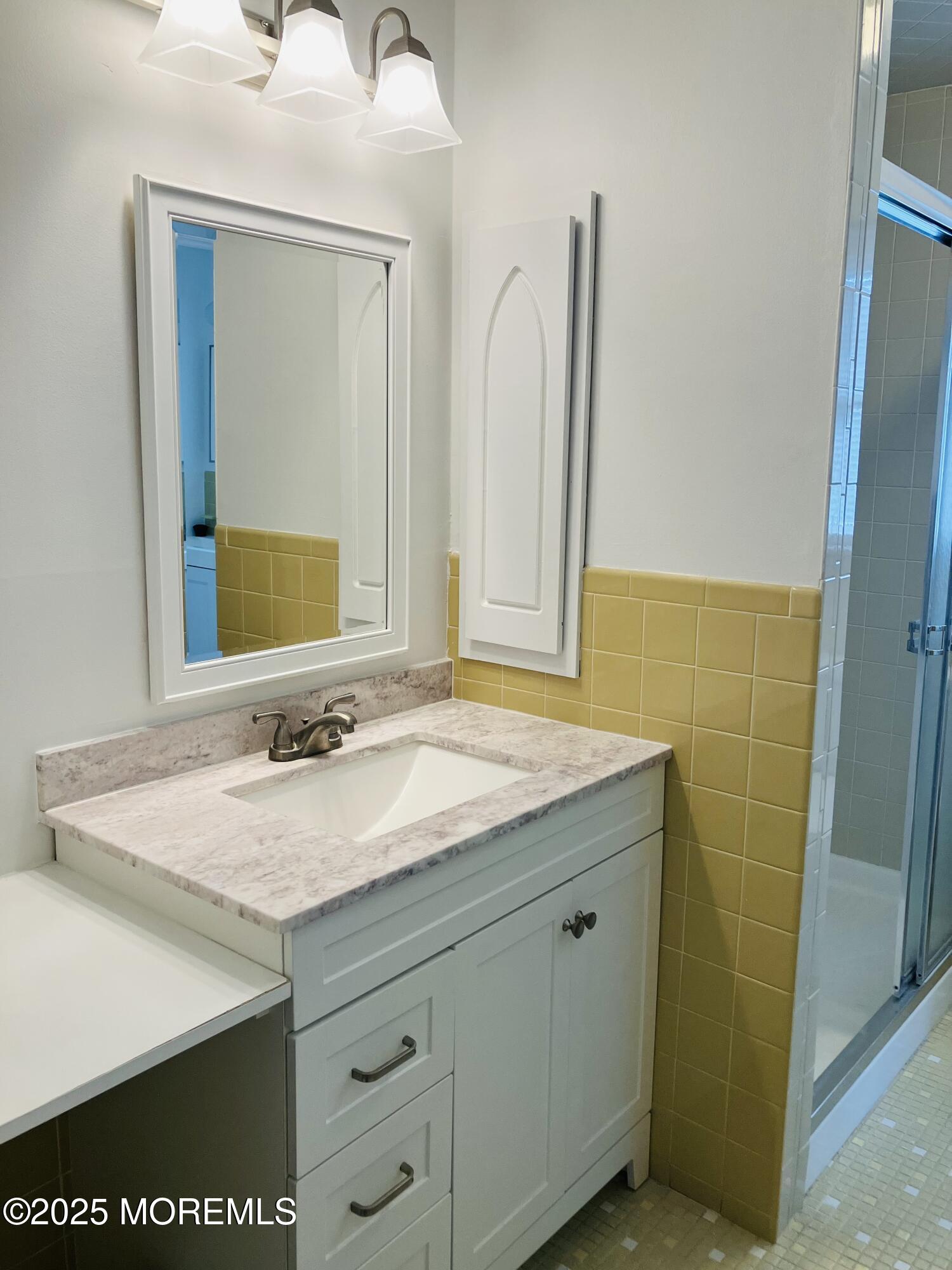 Undisclosed Address Brick, NJ 08724 - Photo 8 of 13 a bathroom with a granite countertop sink and a mirror
