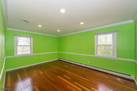 a room with a window and a ceiling fan