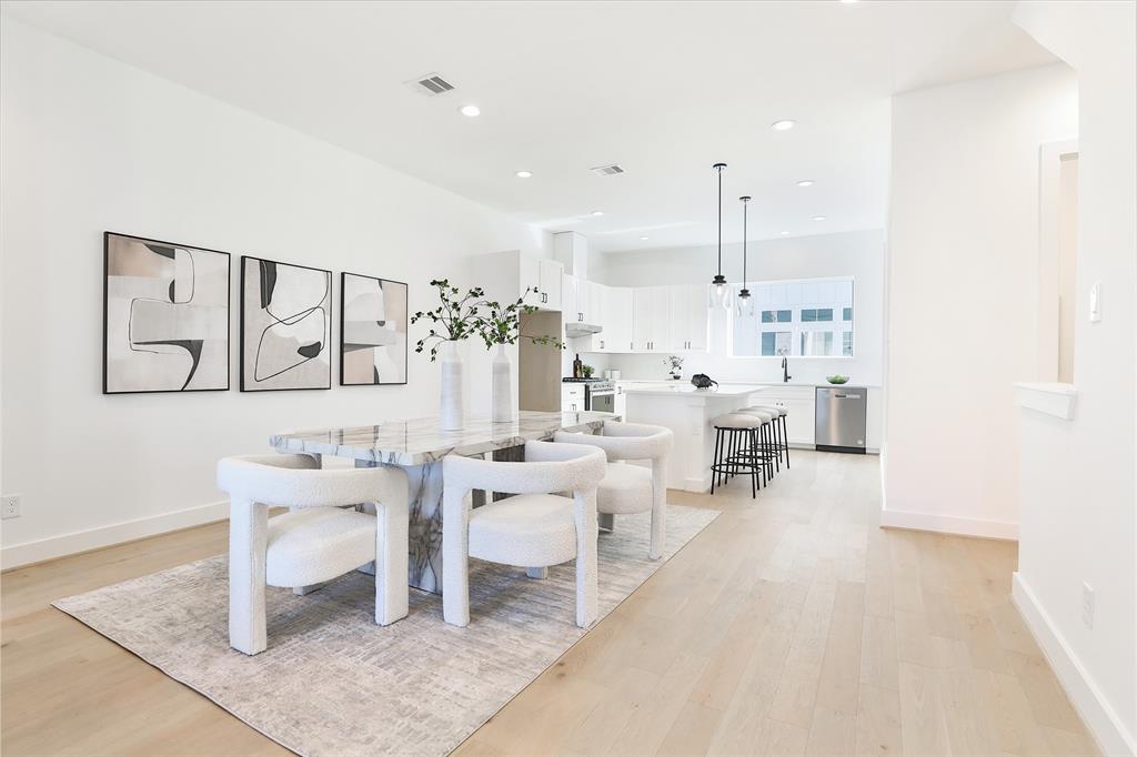 1018A West 15th 1/2 Street, Unit C Houston, TX 77008 - Photo 1 of 50 Picture yourself dining with friends and family in this spacious, open second-floor living area.