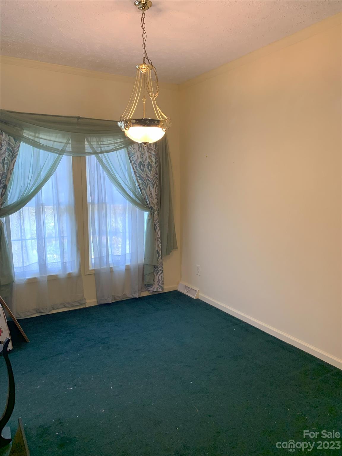 6417 Miller Road Kannapolis, NC 28081 - Photo 11 of 29 a view of room with window and chandelier