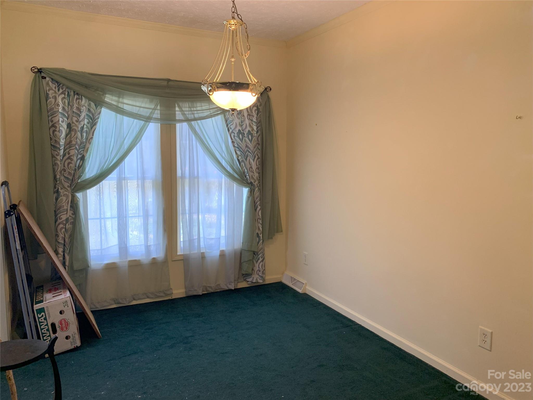 6417 Miller Road Kannapolis, NC 28081 - Photo 12 of 29 a view of an empty room with wooden floor and door