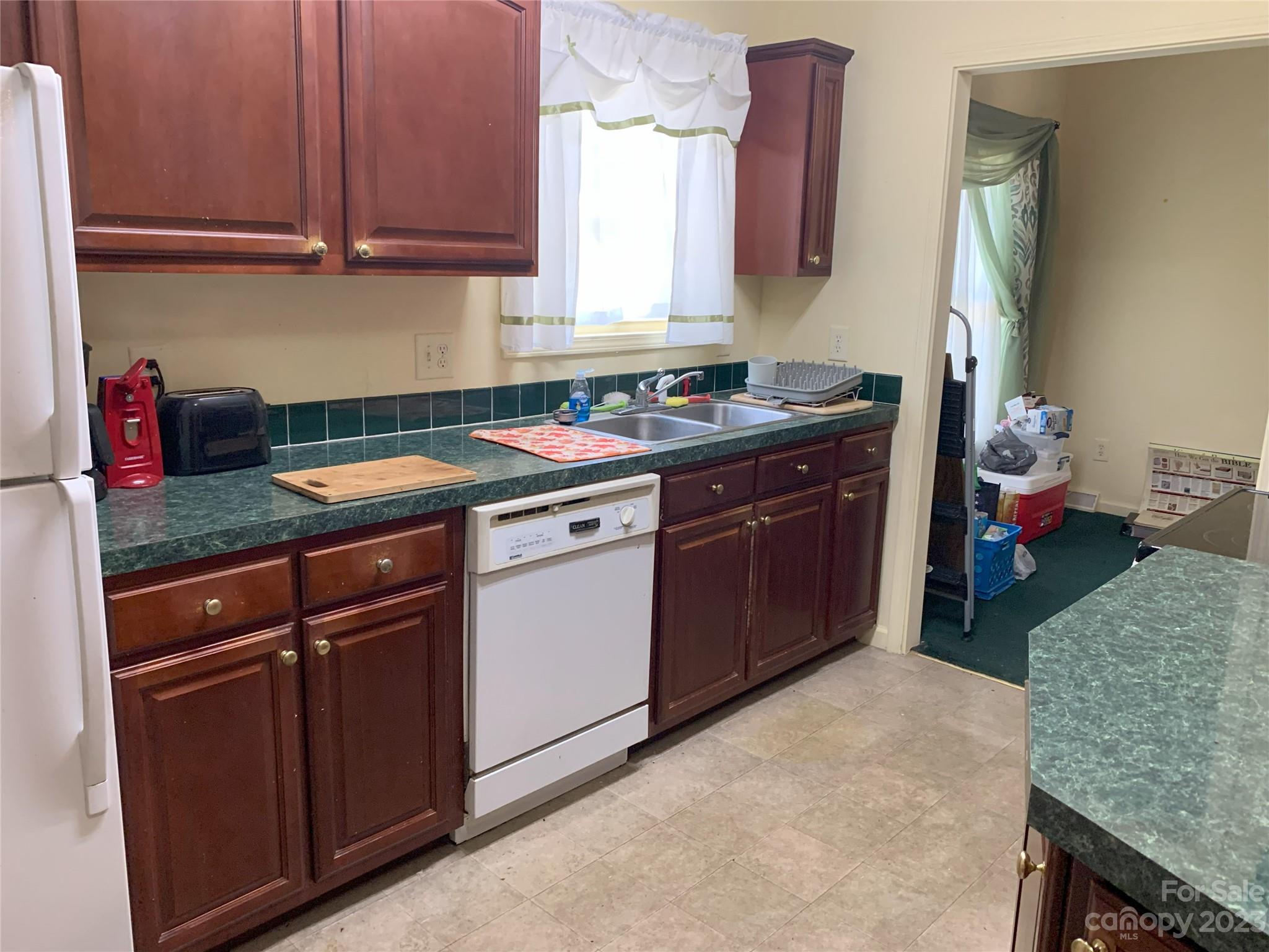 6417 Miller Road Kannapolis, NC 28081 - Photo 17 of 29 a kitchen with a sink stove and cabinets