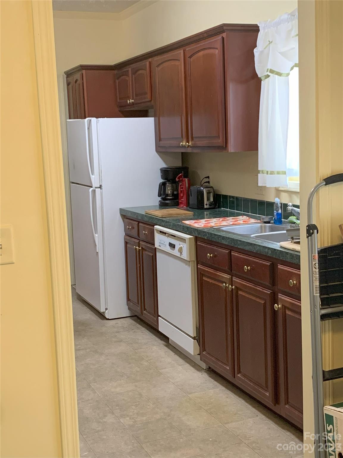6417 Miller Road Kannapolis, NC 28081 - Photo 18 of 29 a kitchen with a refrigerator sink and cabinets