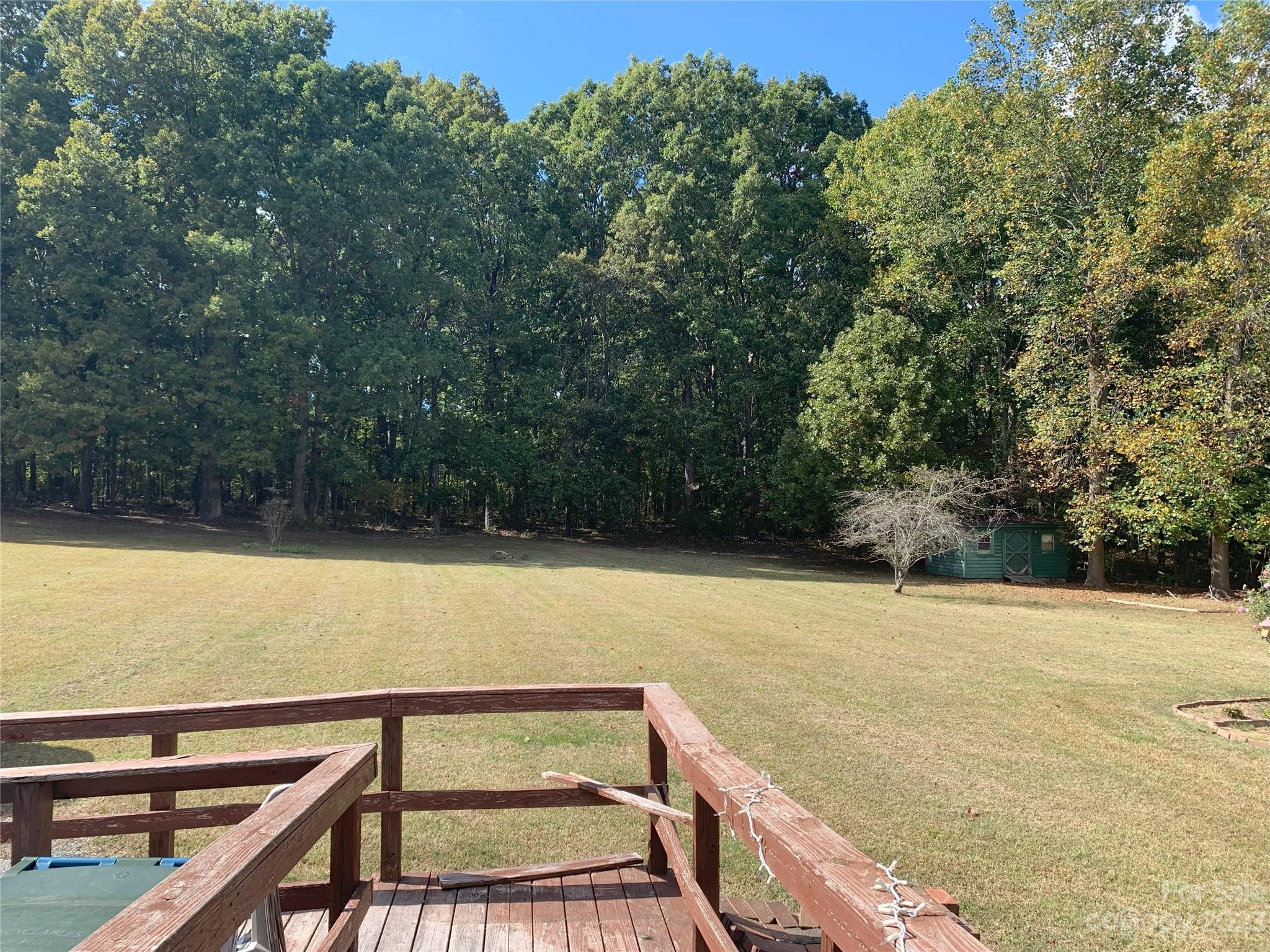 6417 Miller Road Kannapolis, NC 28081 - Photo 6 of 29 a view of a swimming pool with a yard