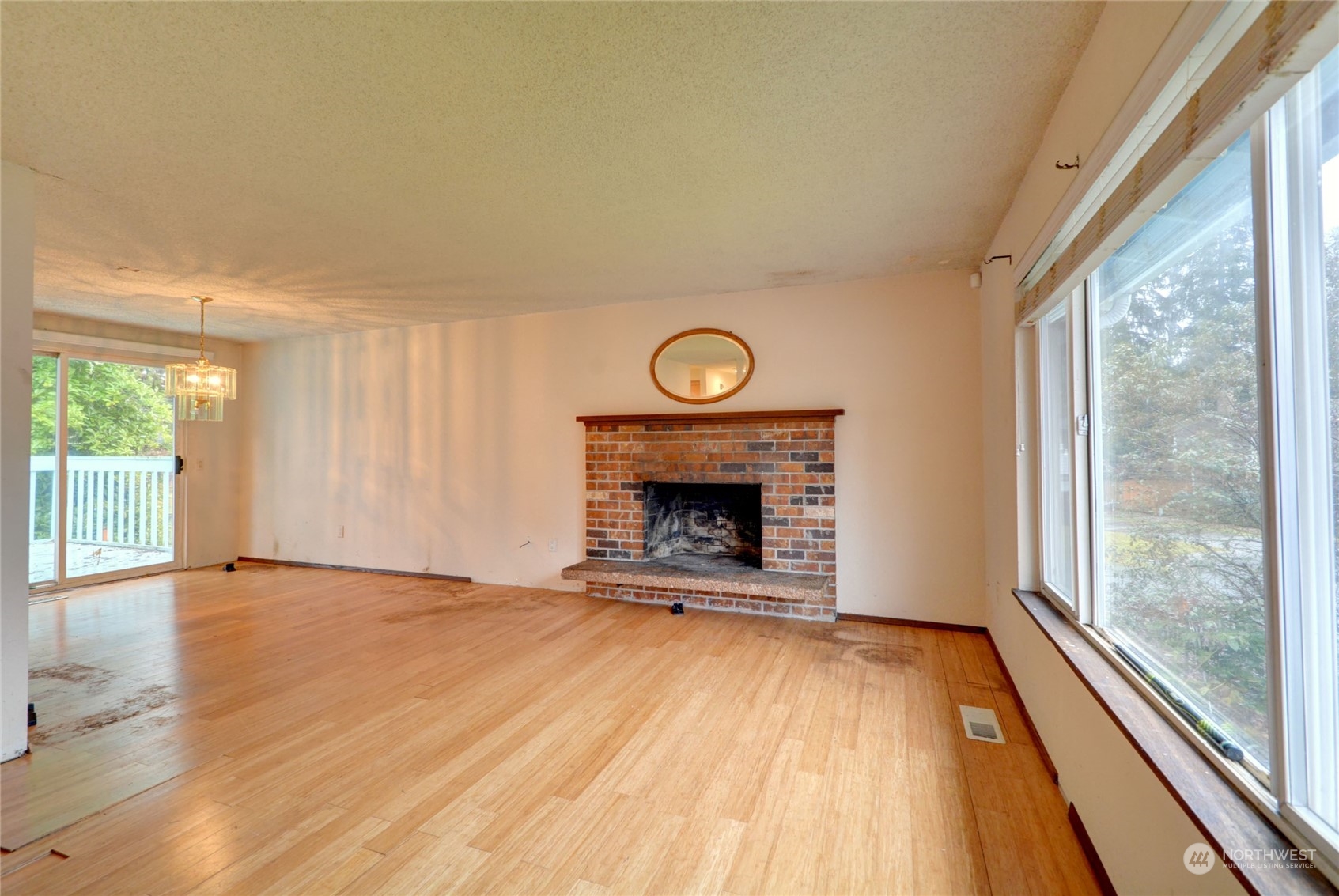 16913 29th Drive Southeast Bothell, WA 98012 - Photo 7 of 17 a view of an empty room with glass door and window