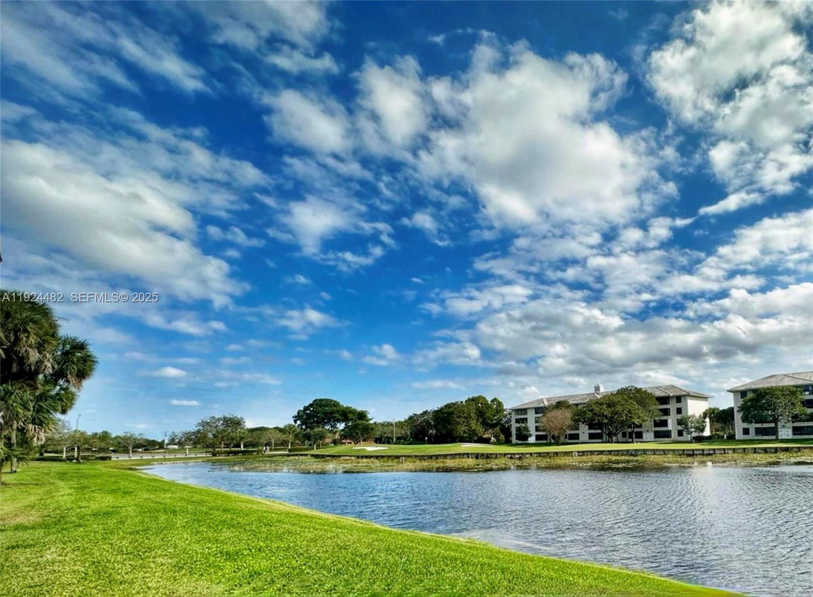 a view of a lake with houses in the back