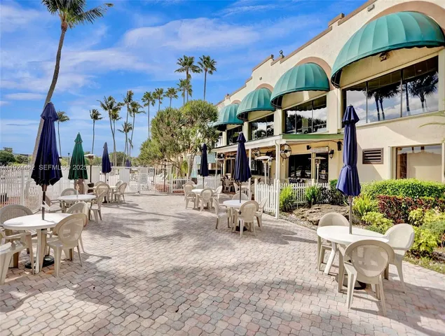 a view of a swimming pool with a yard