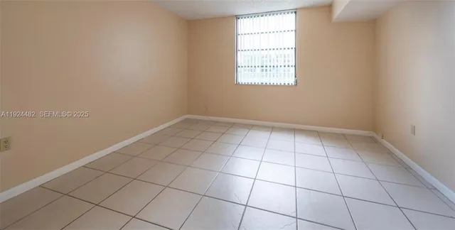 an empty room with white walls