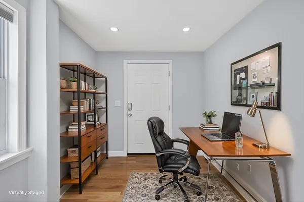 a work room with furniture and wooden floor