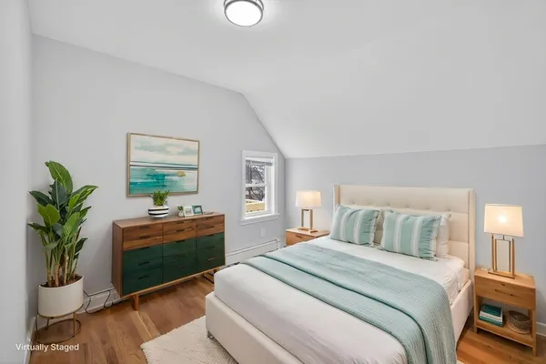 a bedroom with a bed and a couch