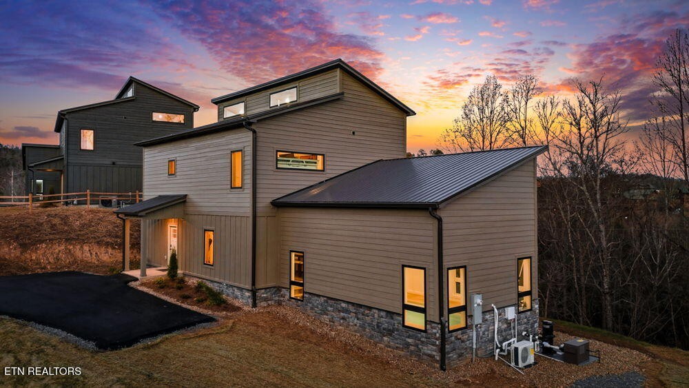 638 Ridge Top Loop Gatlinburg, TN 37738 - Photo 1 of 37 a front view of a house with a yard