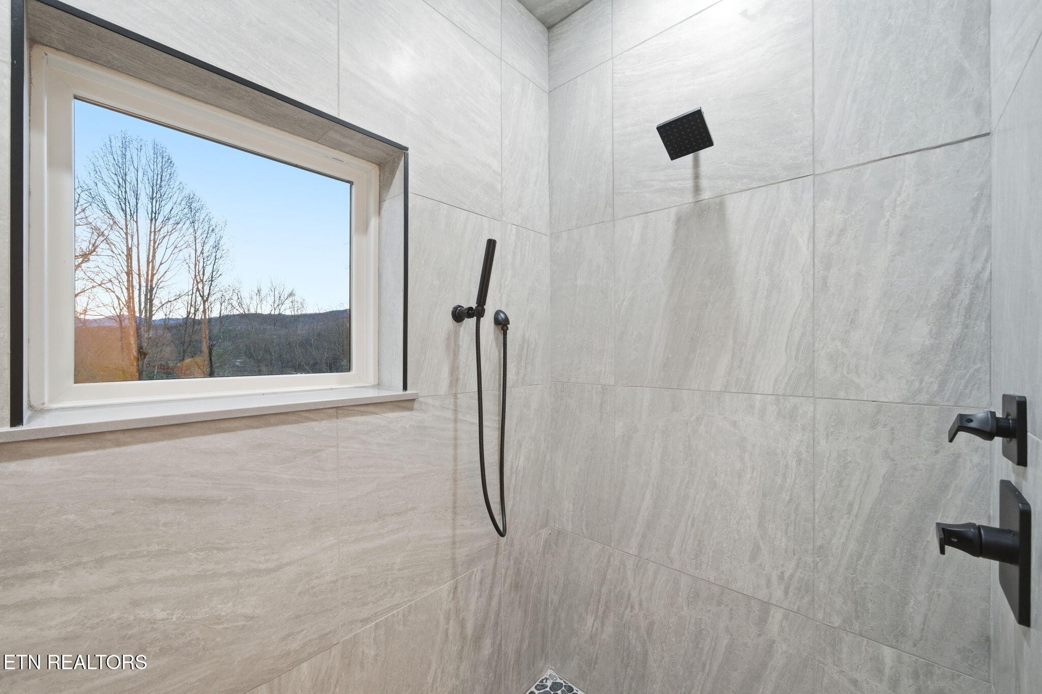 638 Ridge Top Loop Gatlinburg, TN 37738 - Photo 12 of 37 a bathroom with a window and a shower