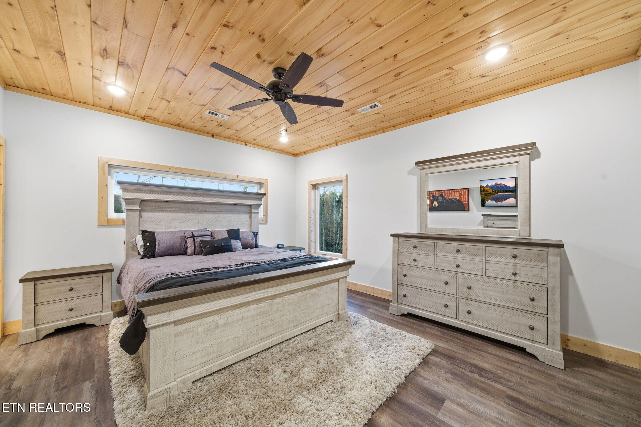 638 Ridge Top Loop Gatlinburg, TN 37738 - Photo 16 of 37 a bedroom with a bed and a chandelier