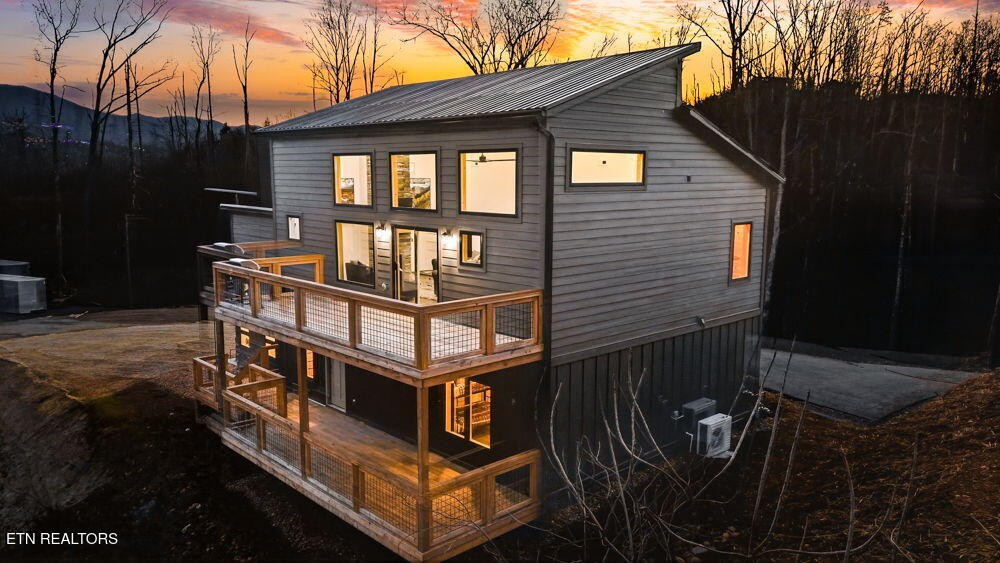 638 Ridge Top Loop Gatlinburg, TN 37738 - Photo 2 of 37 a view of a house with a small deck
