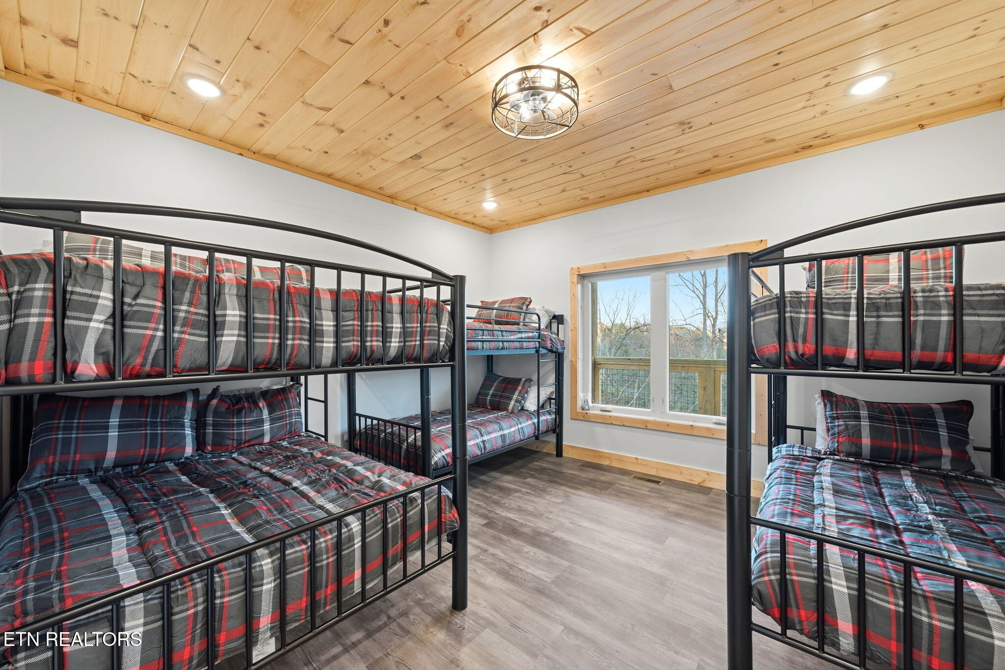 638 Ridge Top Loop Gatlinburg, TN 37738 - Photo 22 of 37 a bedroom with a bed and a large window