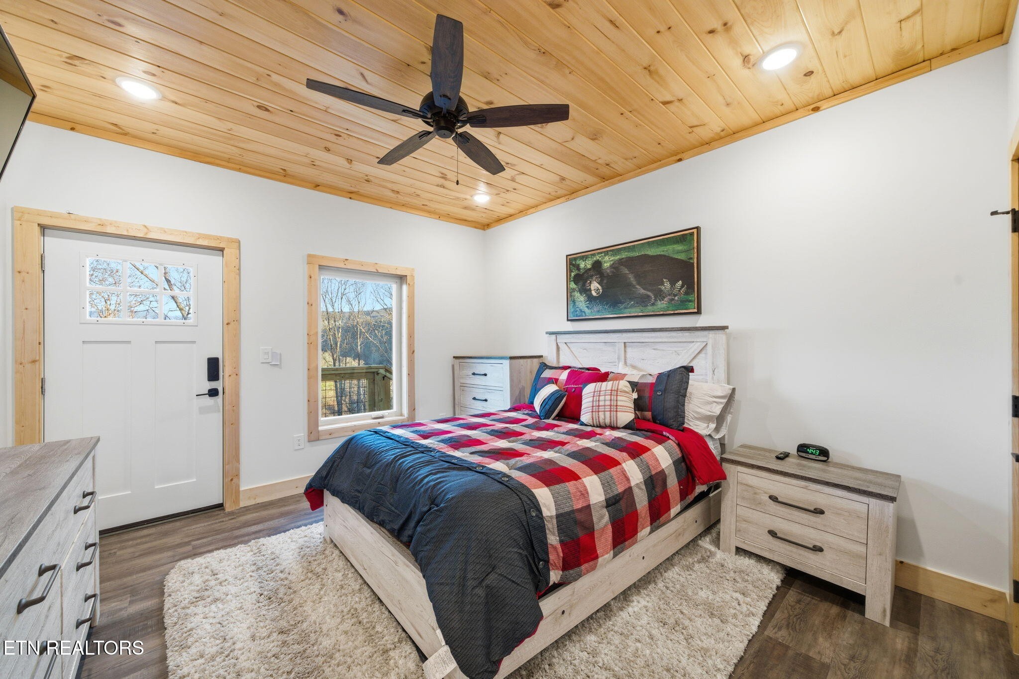 638 Ridge Top Loop Gatlinburg, TN 37738 - Photo 24 of 37 a bedroom with a bed a ceiling fan and a dresser