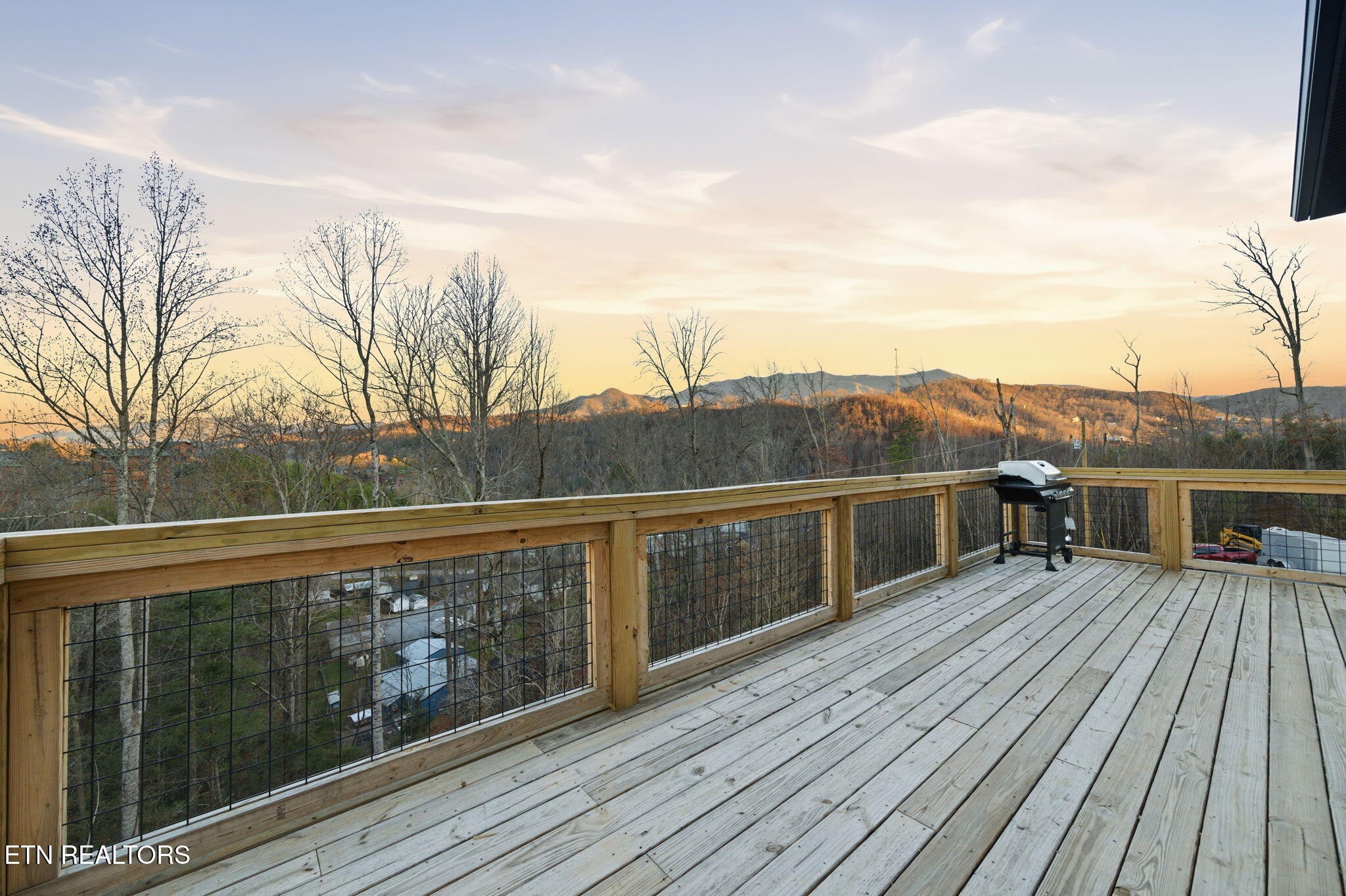 638 Ridge Top Loop Gatlinburg, TN 37738 - Photo 4 of 37 a view of house with roof deck and wooden floor