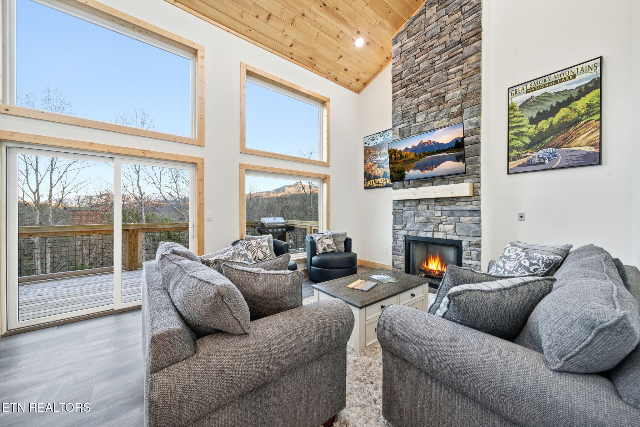 638 Ridge Top Loop Gatlinburg, TN 37738 - Photo 5 of 37 a living room with furniture a fireplace and a large window