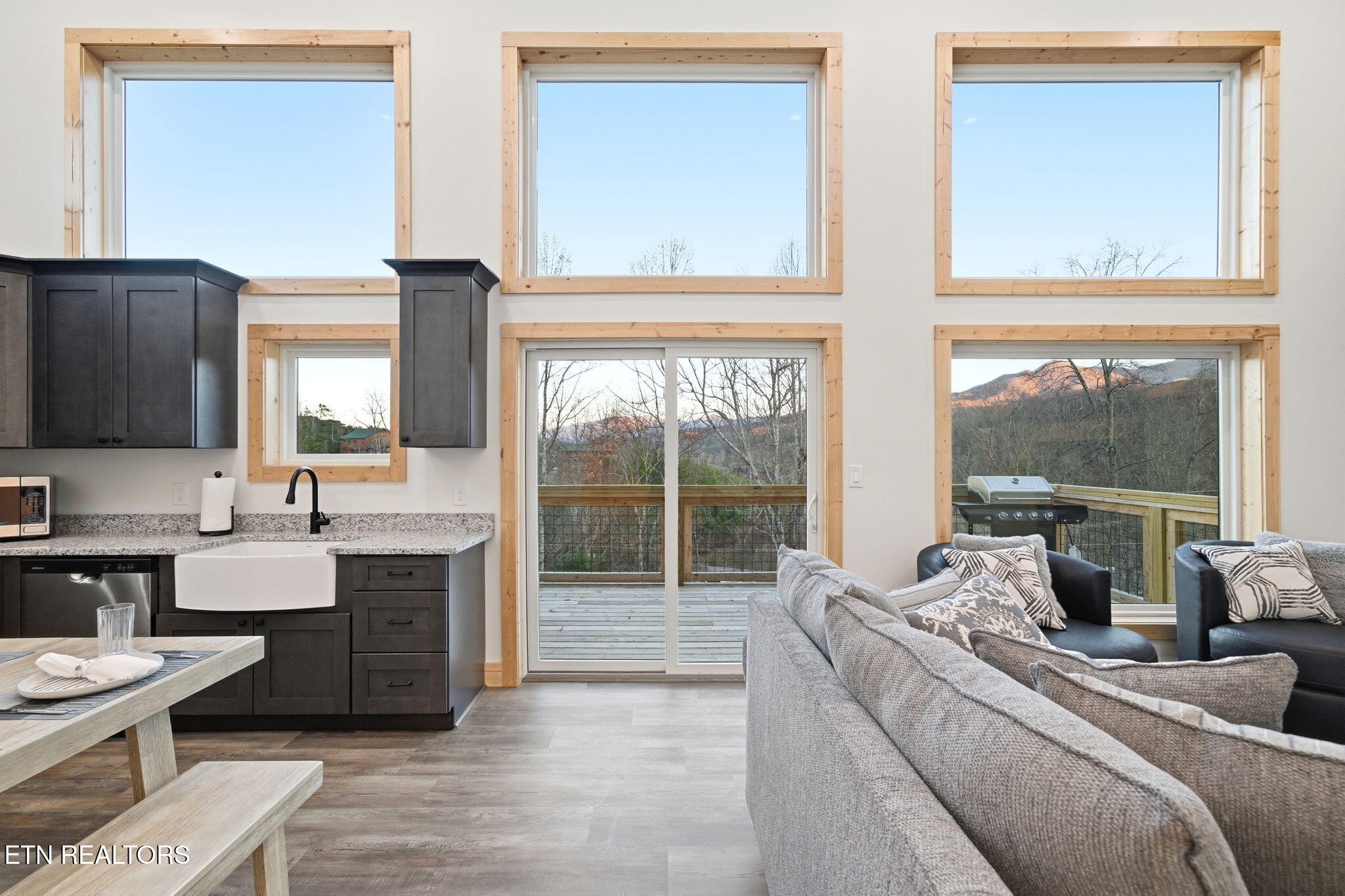 638 Ridge Top Loop Gatlinburg, TN 37738 - Photo 7 of 37 a living room with furniture a large window and a flat screen tv