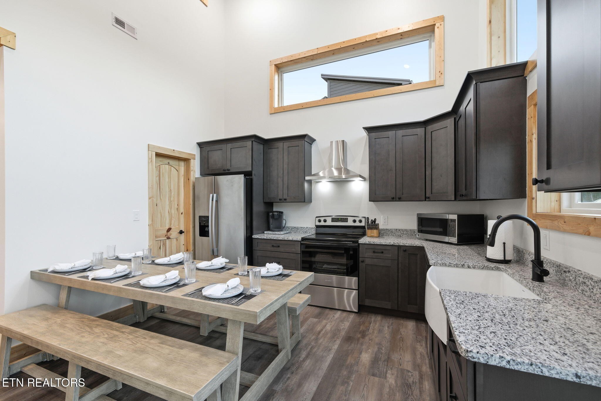 638 Ridge Top Loop Gatlinburg, TN 37738 - Photo 9 of 37 a kitchen with granite countertop a sink appliances and cabinets