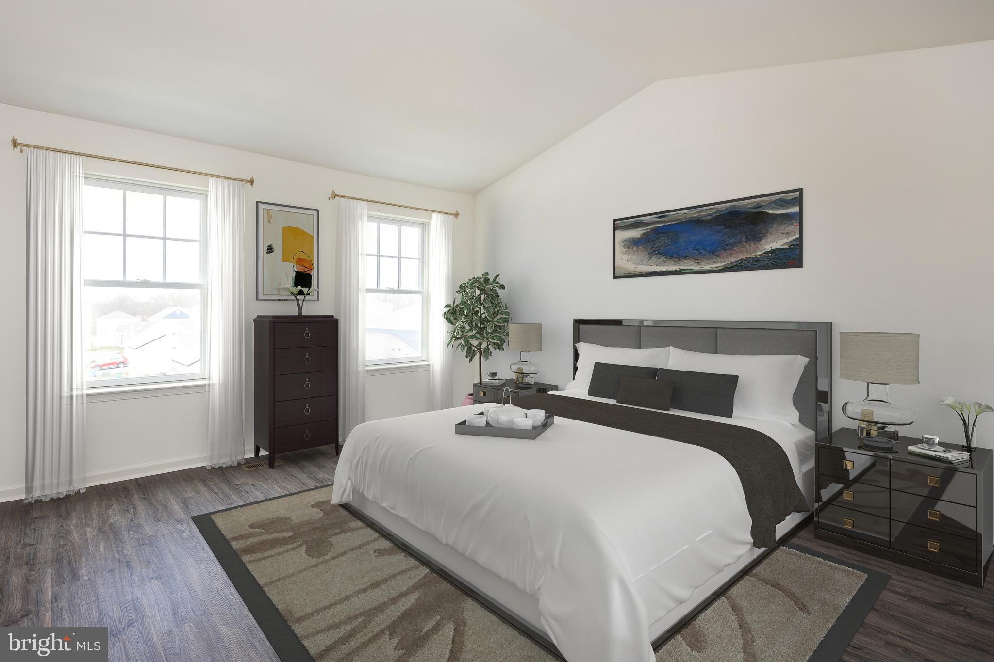 873 Mapleton Avenue, Unit 188 Middletown, DE 19709 - Photo 11 of 24 a bedroom with a bed and wooden floor