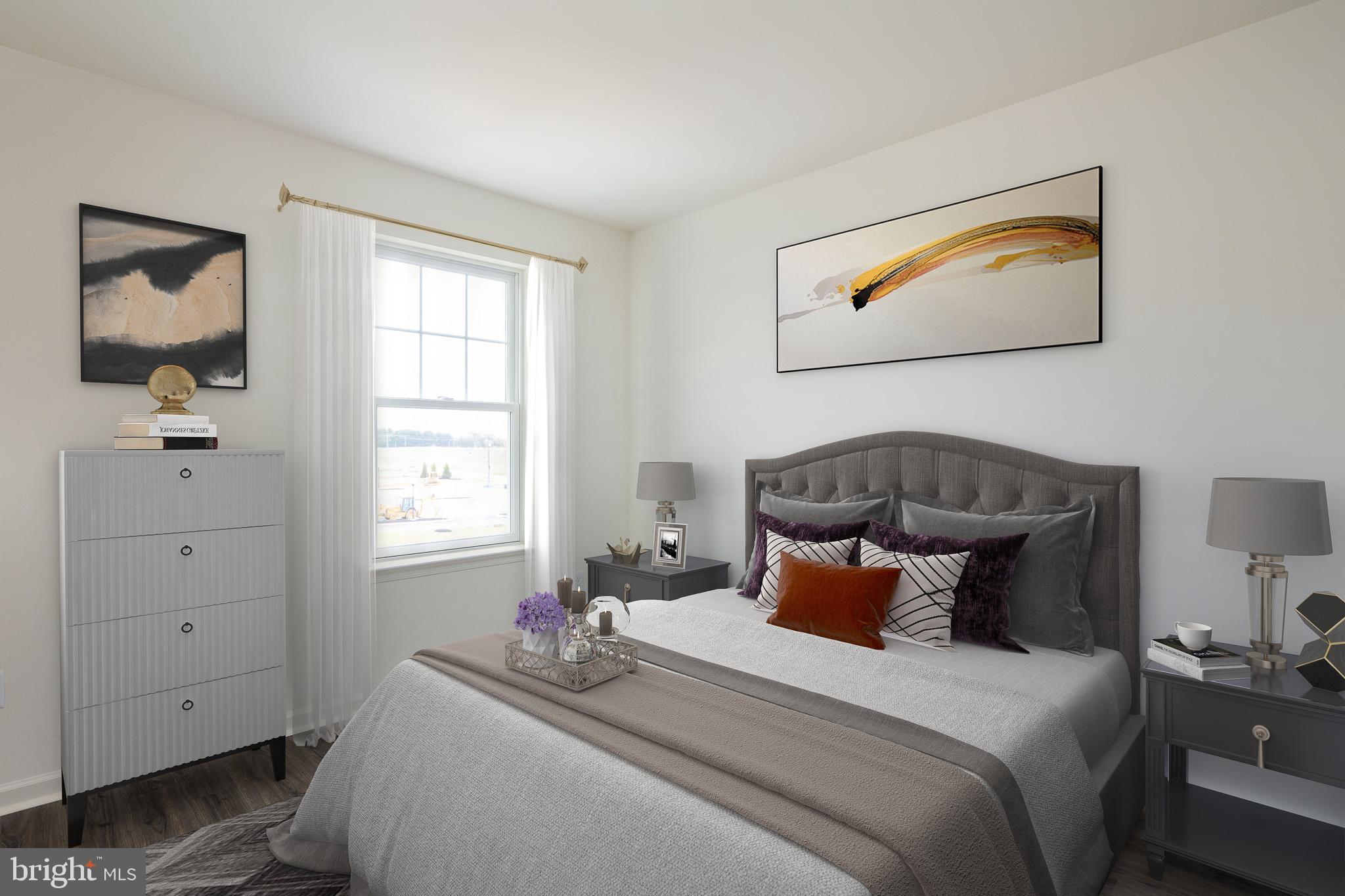 873 Mapleton Avenue, Unit 188 Middletown, DE 19709 - Photo 13 of 24 a bedroom with a bed and wooden floor