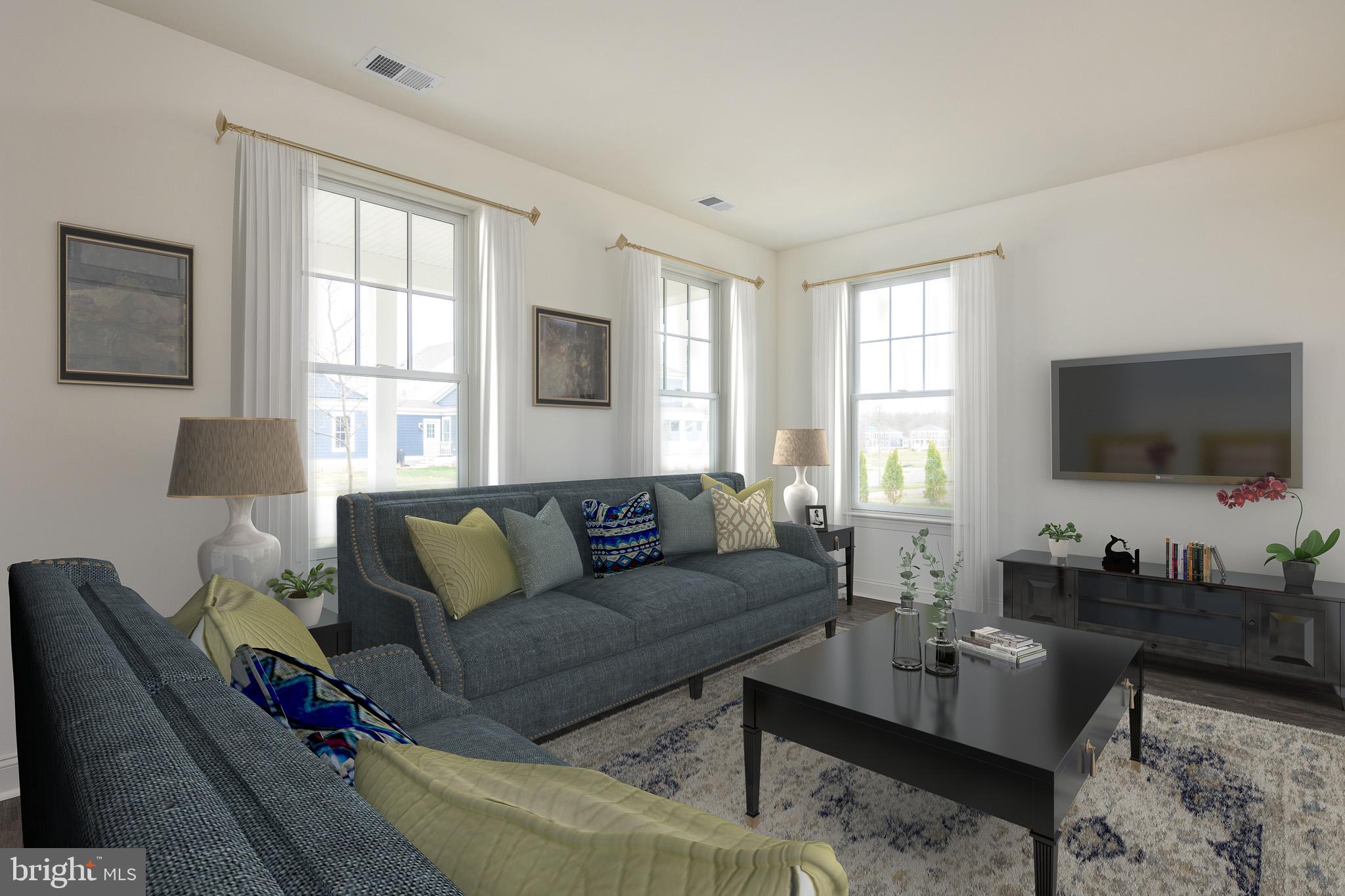 873 Mapleton Avenue, Unit 188 Middletown, DE 19709 - Photo 18 of 24 a living room with furniture and a flat screen tv
