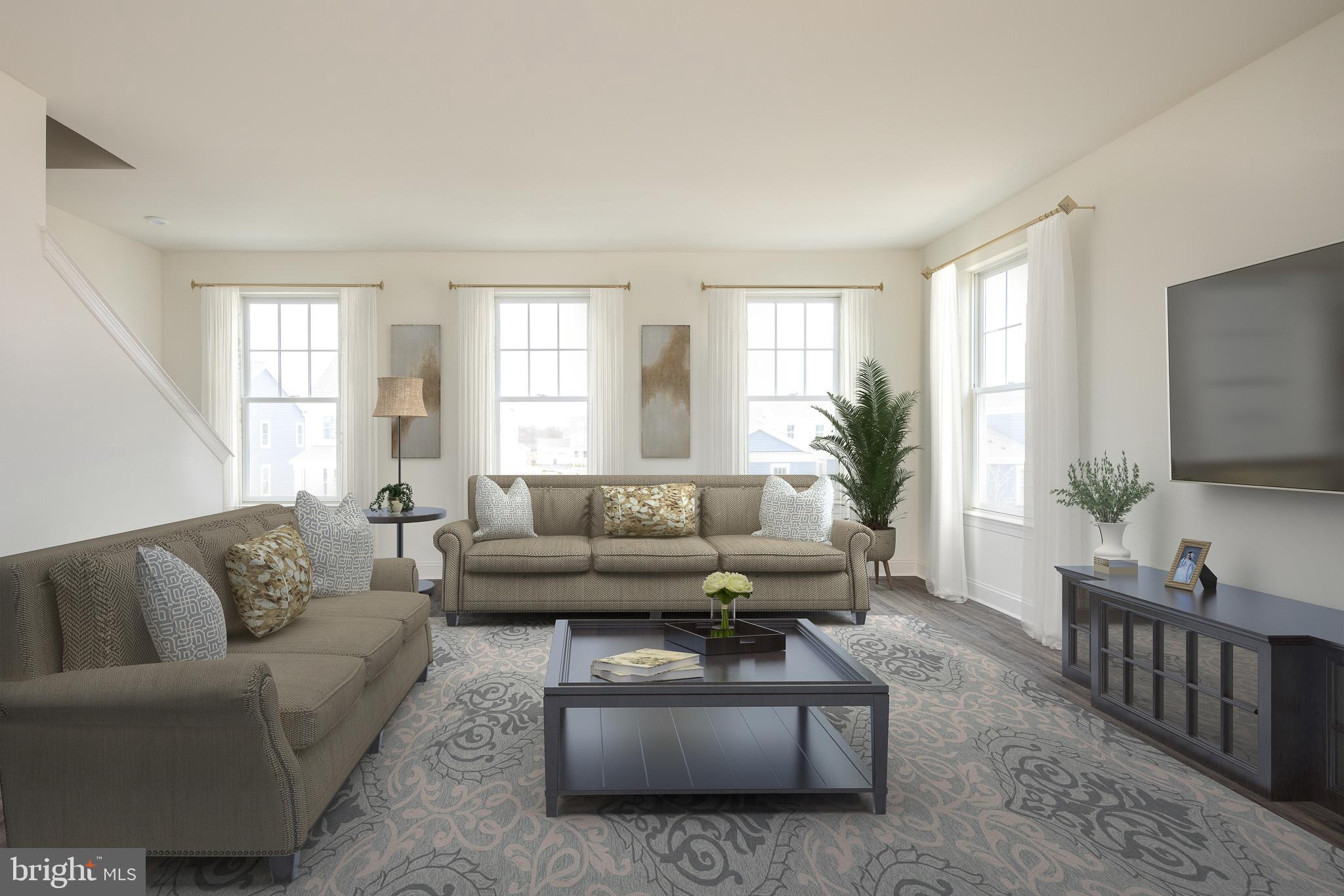 873 Mapleton Avenue, Unit 188 Middletown, DE 19709 - Photo 9 of 24 a living room with furniture and a flat screen tv
