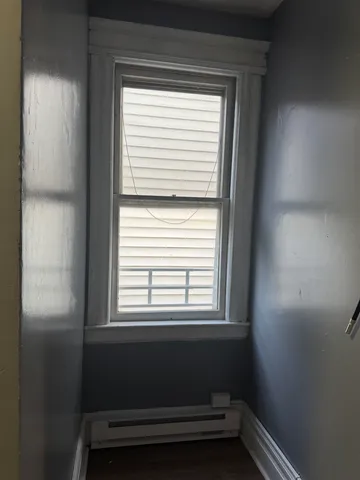 a view of a room that has a window in it