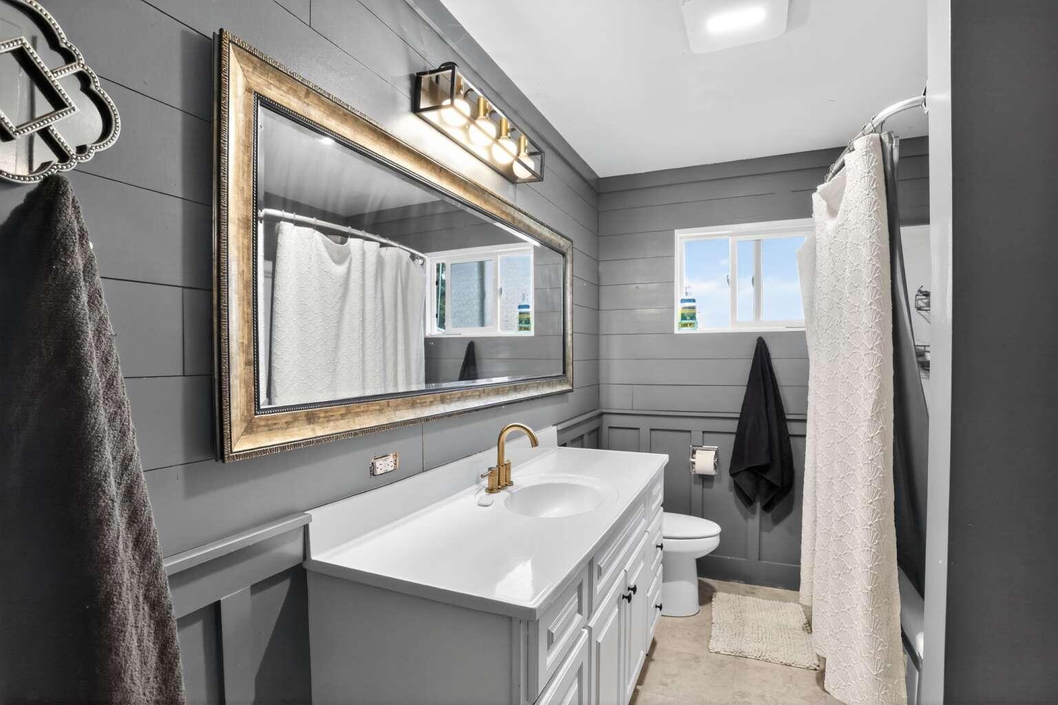 7408 Bridge Lane Redding, CA 96002 - Photo 11 of 25 a bathroom with a sink and a mirror