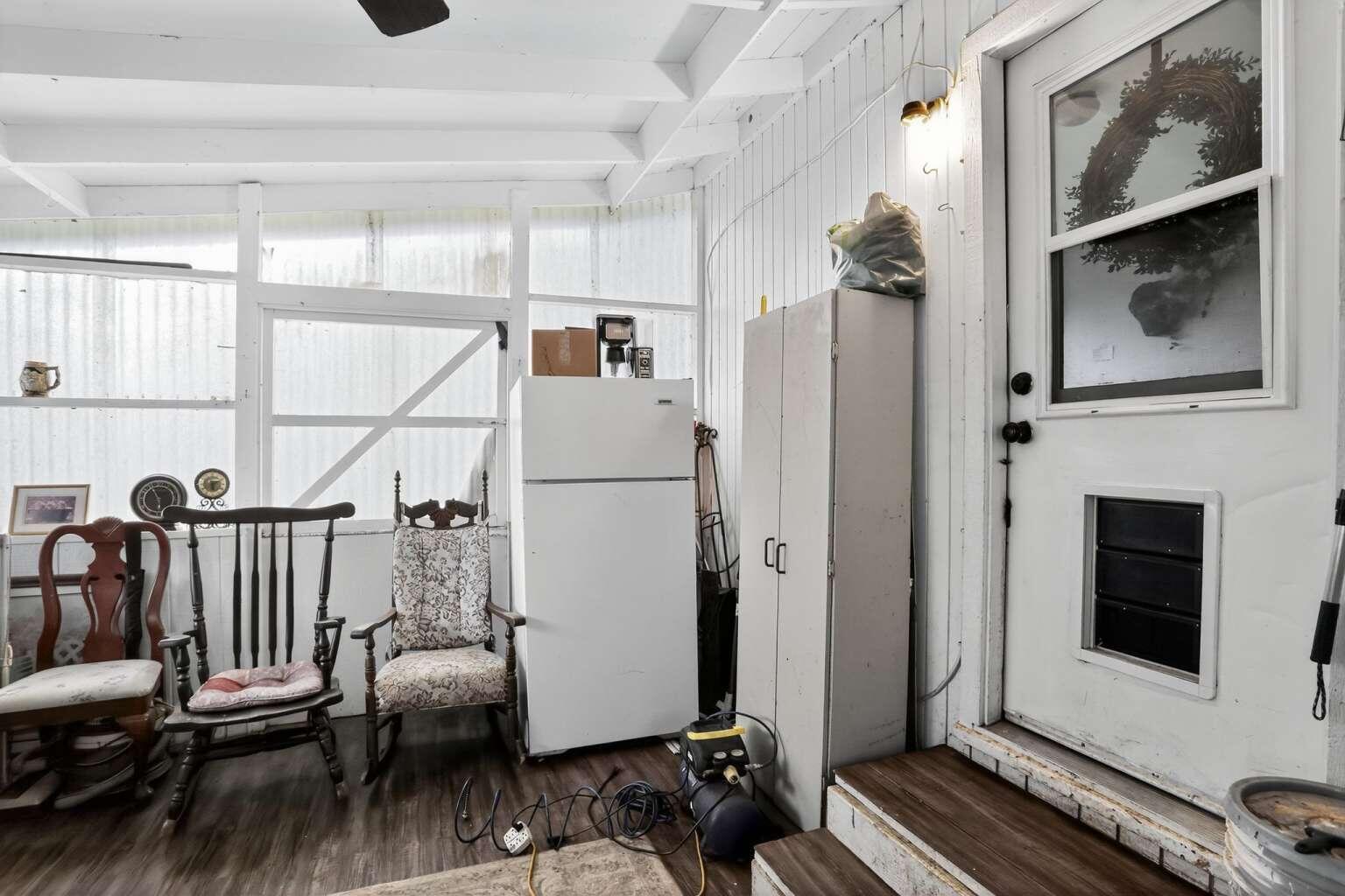 7408 Bridge Lane Redding, CA 96002 - Photo 18 of 25 a living room with furniture a fireplace and a flat screen tv