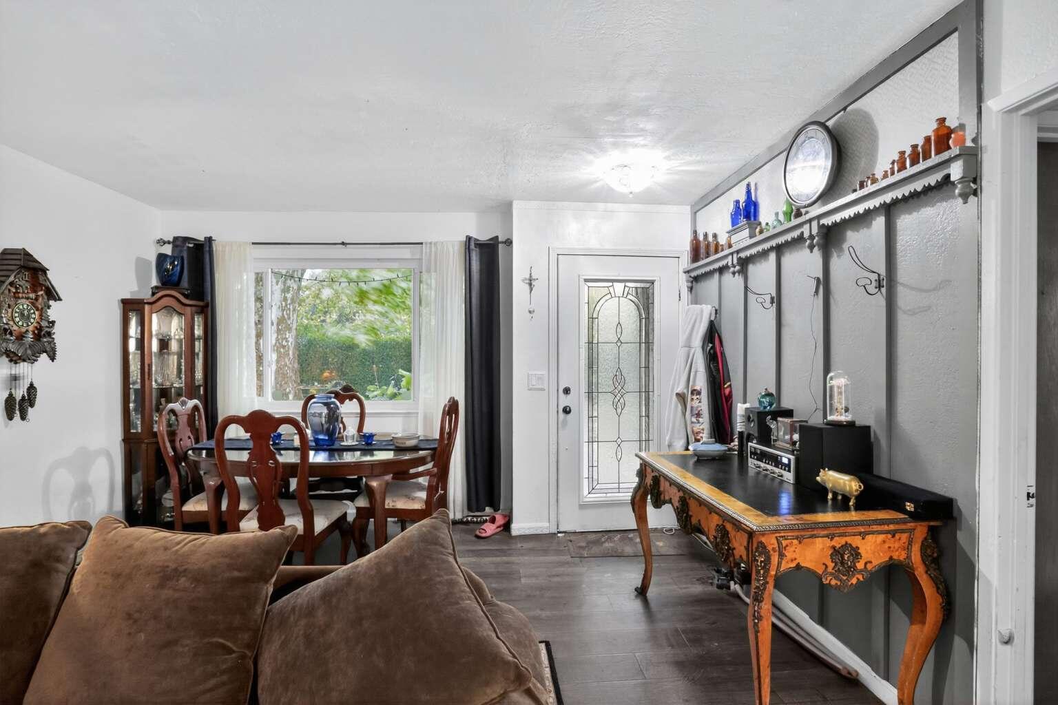 7408 Bridge Lane Redding, CA 96002 - Photo 20 of 25 a living room with furniture a floor to ceiling window and a ceiling fan