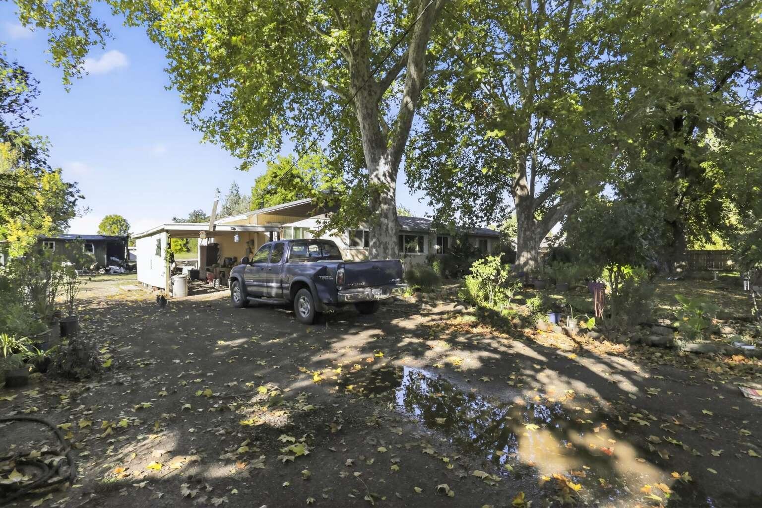 7408 Bridge Lane Redding, CA 96002 - Photo 23 of 25 a view of yard with car parked