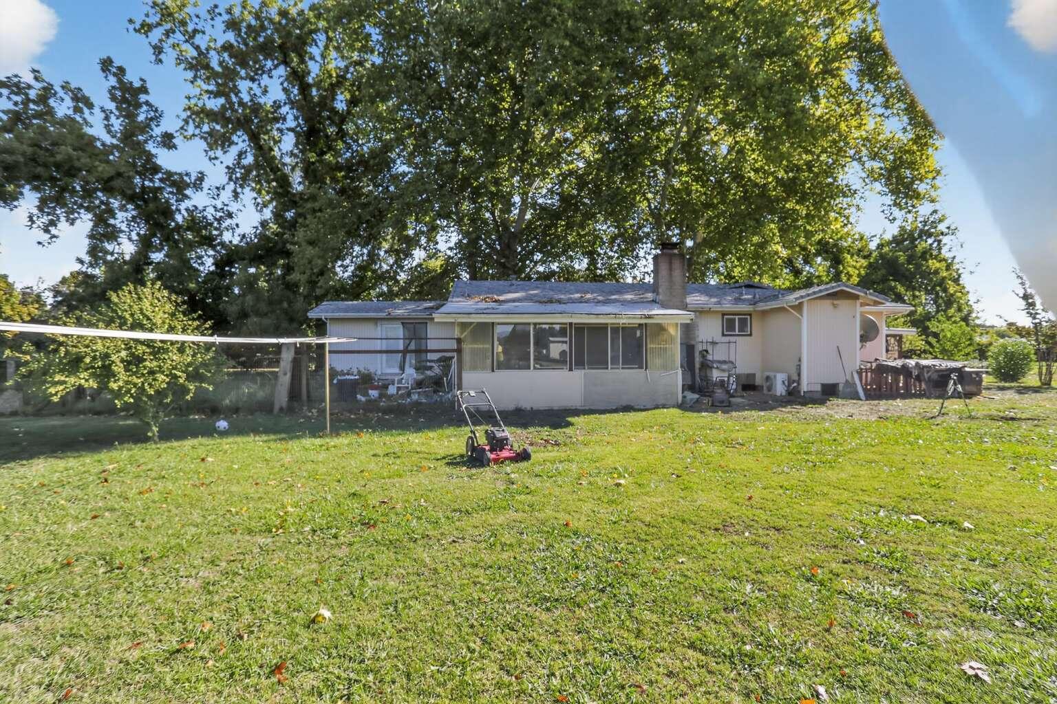 7408 Bridge Lane Redding, CA 96002 - Photo 24 of 25 a front view of house with yard and seating