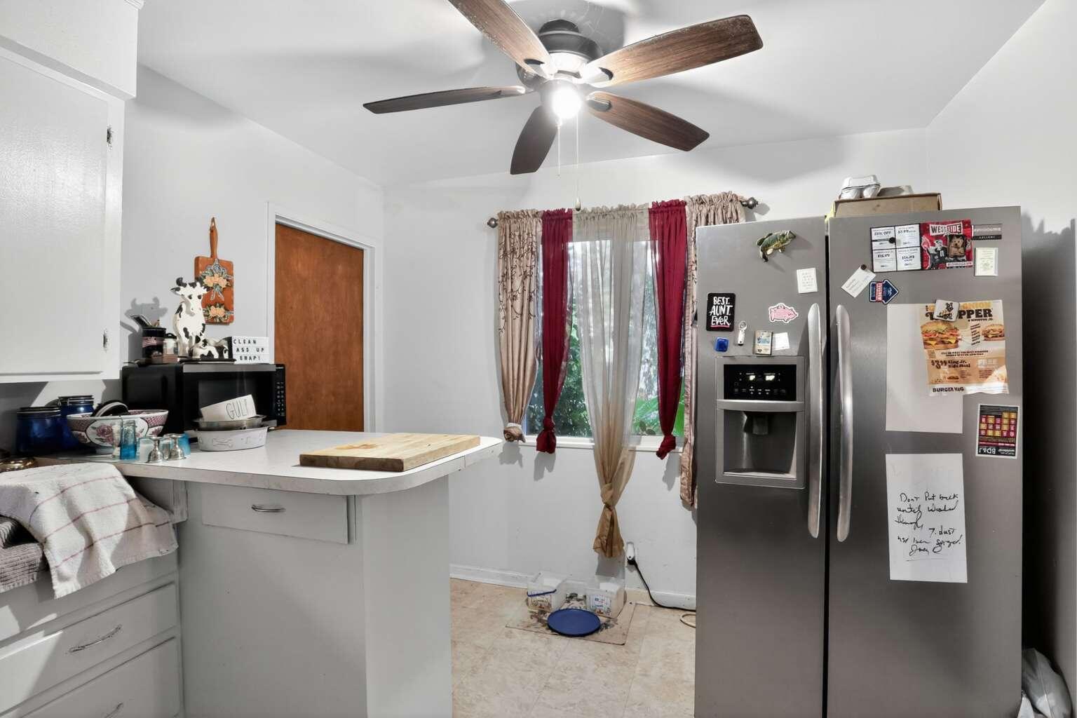 7408 Bridge Lane Redding, CA 96002 - Photo 4 of 25 a view of a livingroom with furniture and ceiling fan