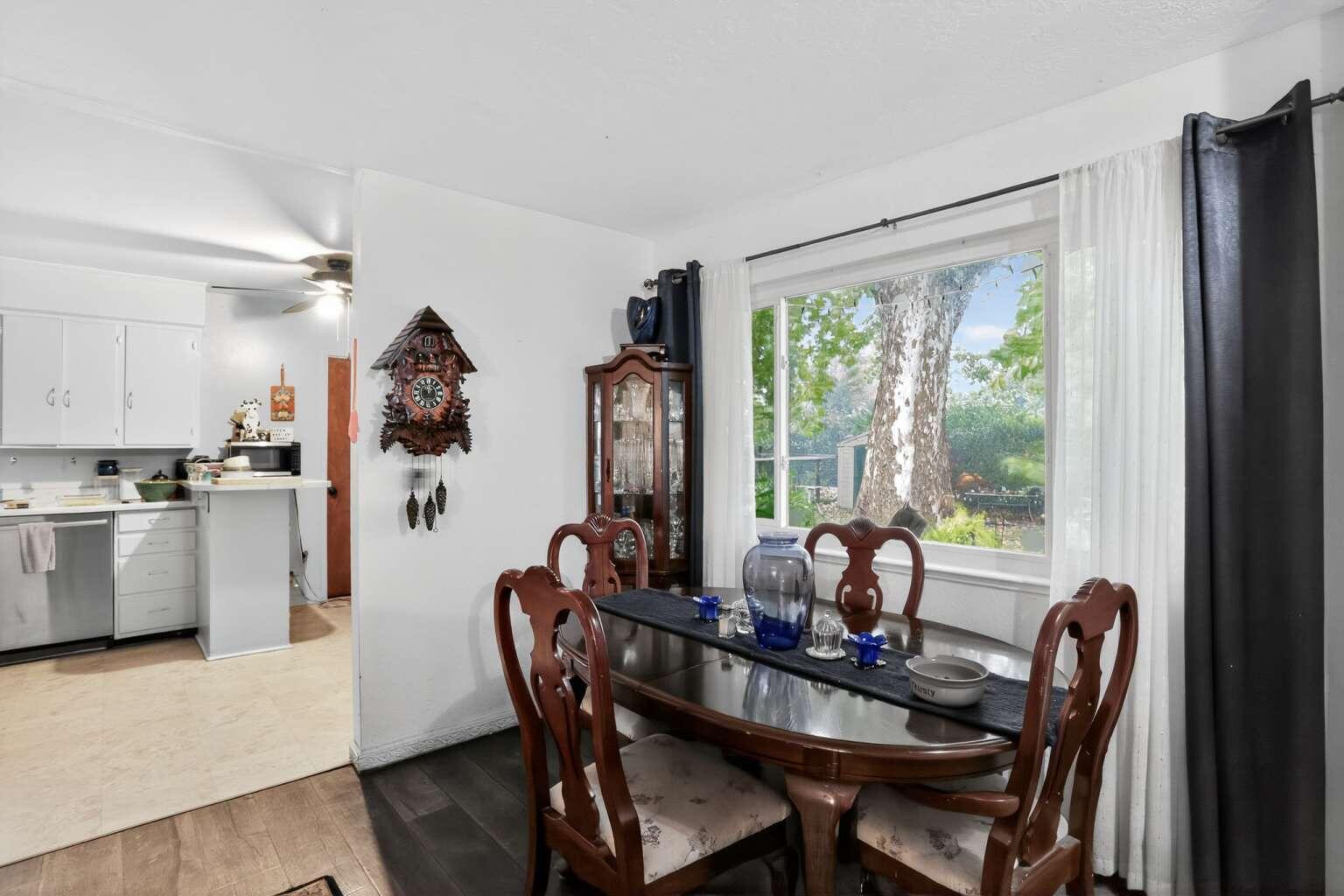 7408 Bridge Lane Redding, CA 96002 - Photo 9 of 25 a view of a dining room with furniture window and outside view