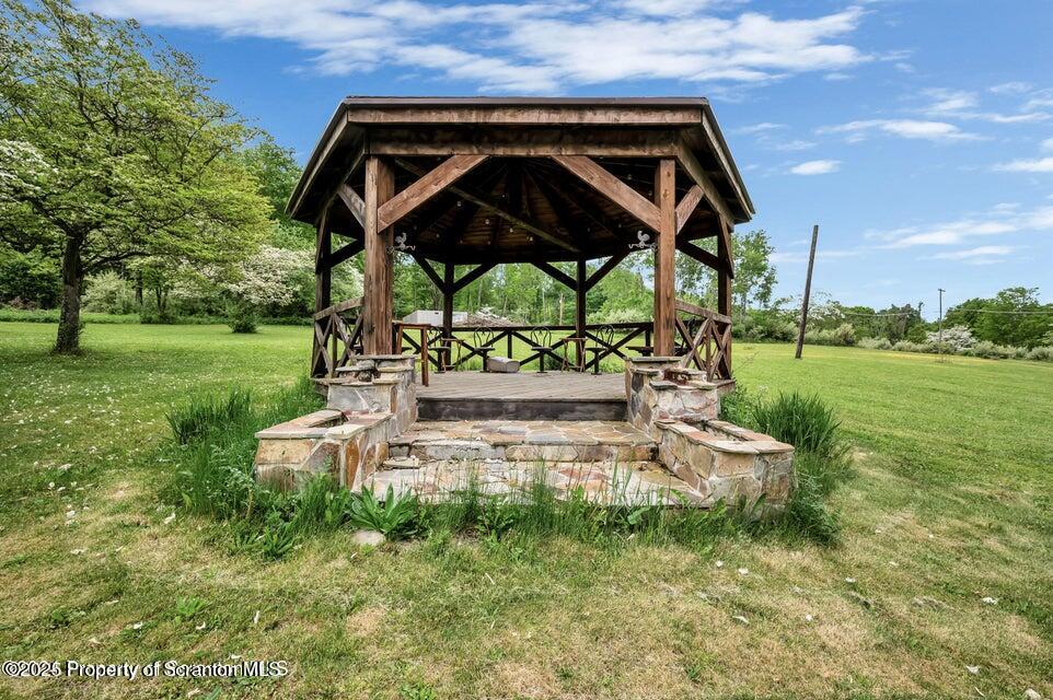 2694 Ransom Road Clarks Summit, PA 18411 - Photo 13 of 16 a view of a chair and table in the garden