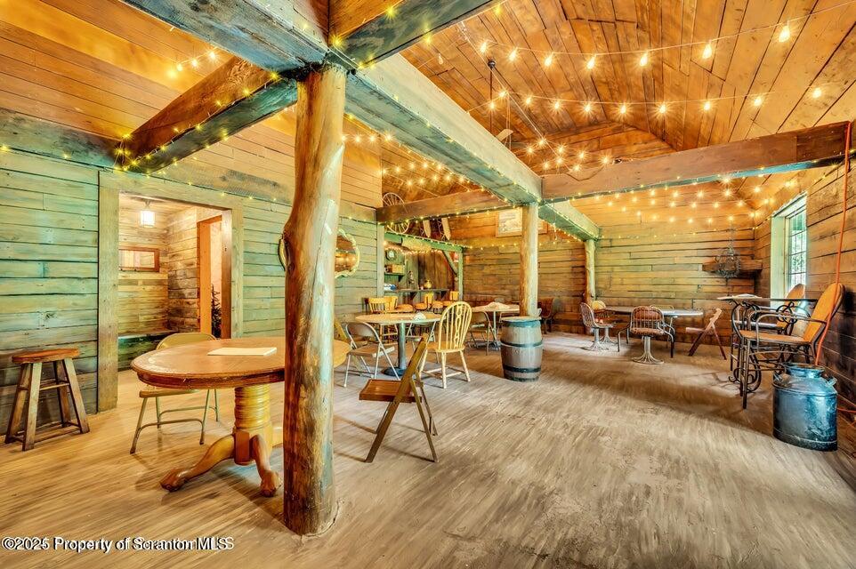 2694 Ransom Road Clarks Summit, PA 18411 - Photo 4 of 16 a view of a patio with table and chairs and potted plants