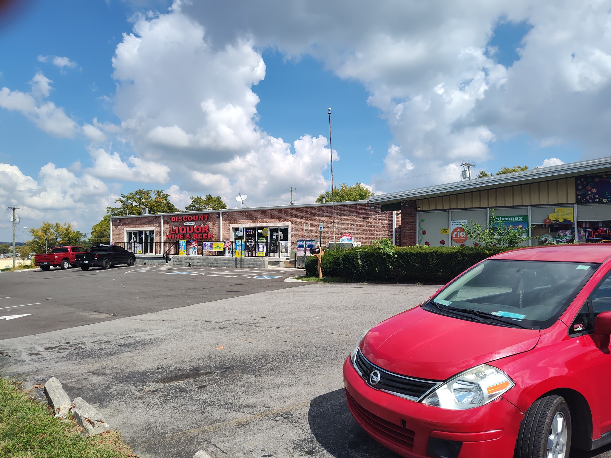 1706 Memorial Boulevard Springfield, TN 37172 - Photo 6 of 6 a red car parked in front of a building