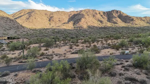 a view of a mountain with mountains in the background