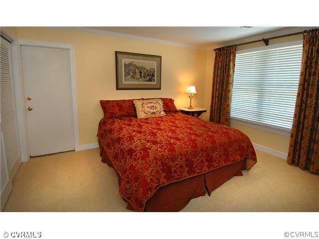 1939 Albion Road Midlothian, VA 23113 - Photo 12 of 18 a bed room with a bed and a painting