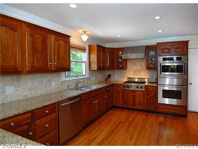 1939 Albion Road Midlothian, VA 23113 - Photo 4 of 18 a kitchen with stainless steel appliances granite countertop a stove a sink and a microwave