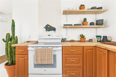 a utility room with sink dryer and washer