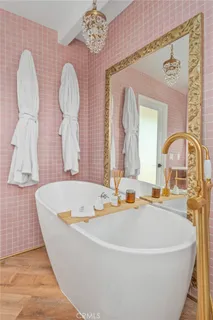 a bath tub sitting next to a bathroom sink