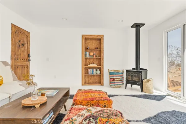 a bedroom with furniture and a window