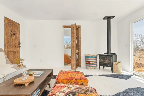 a bedroom with furniture and a window
