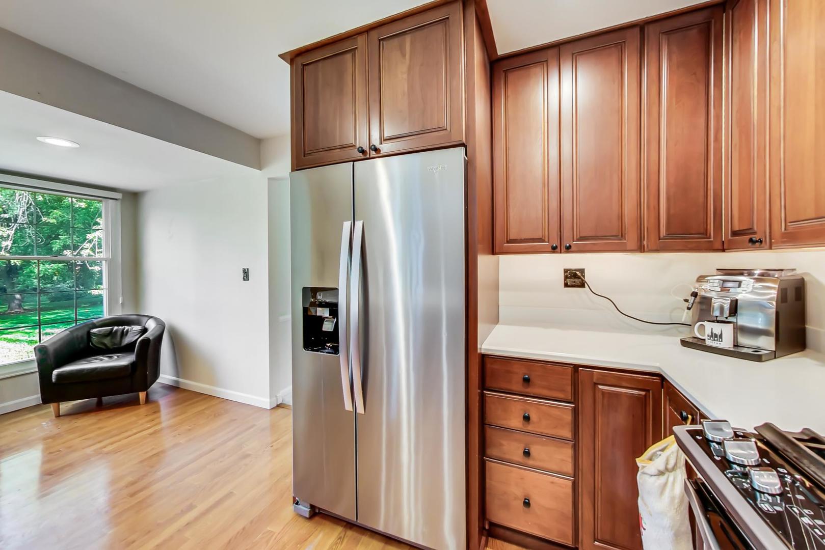 2210 Freeman Court Inverness, IL 60067 - Photo 14 of 56 a kitchen with granite countertop wooden cabinets and stainless steel appliances