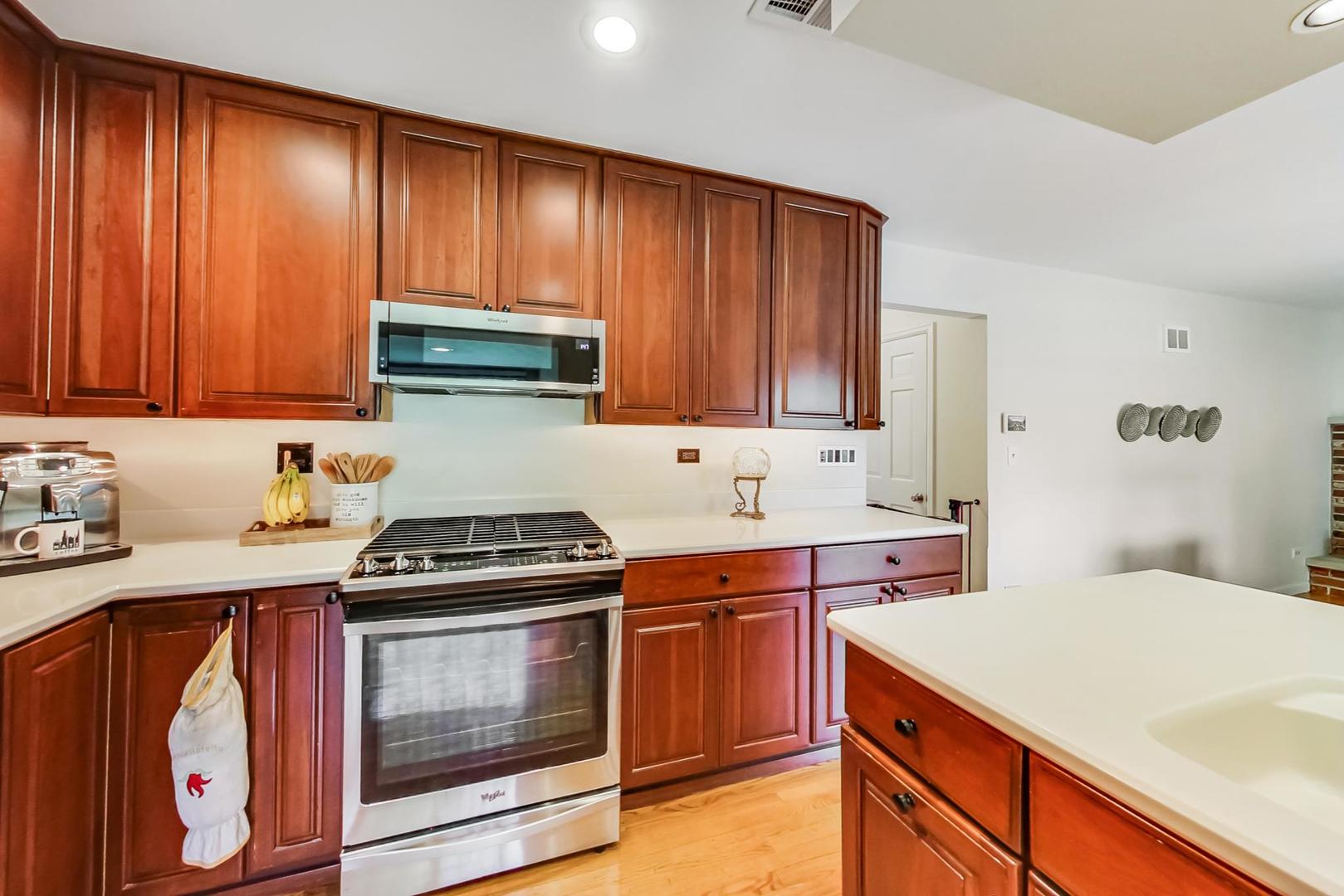 2210 Freeman Court Inverness, IL 60067 - Photo 15 of 56 a kitchen with a stove and a sink