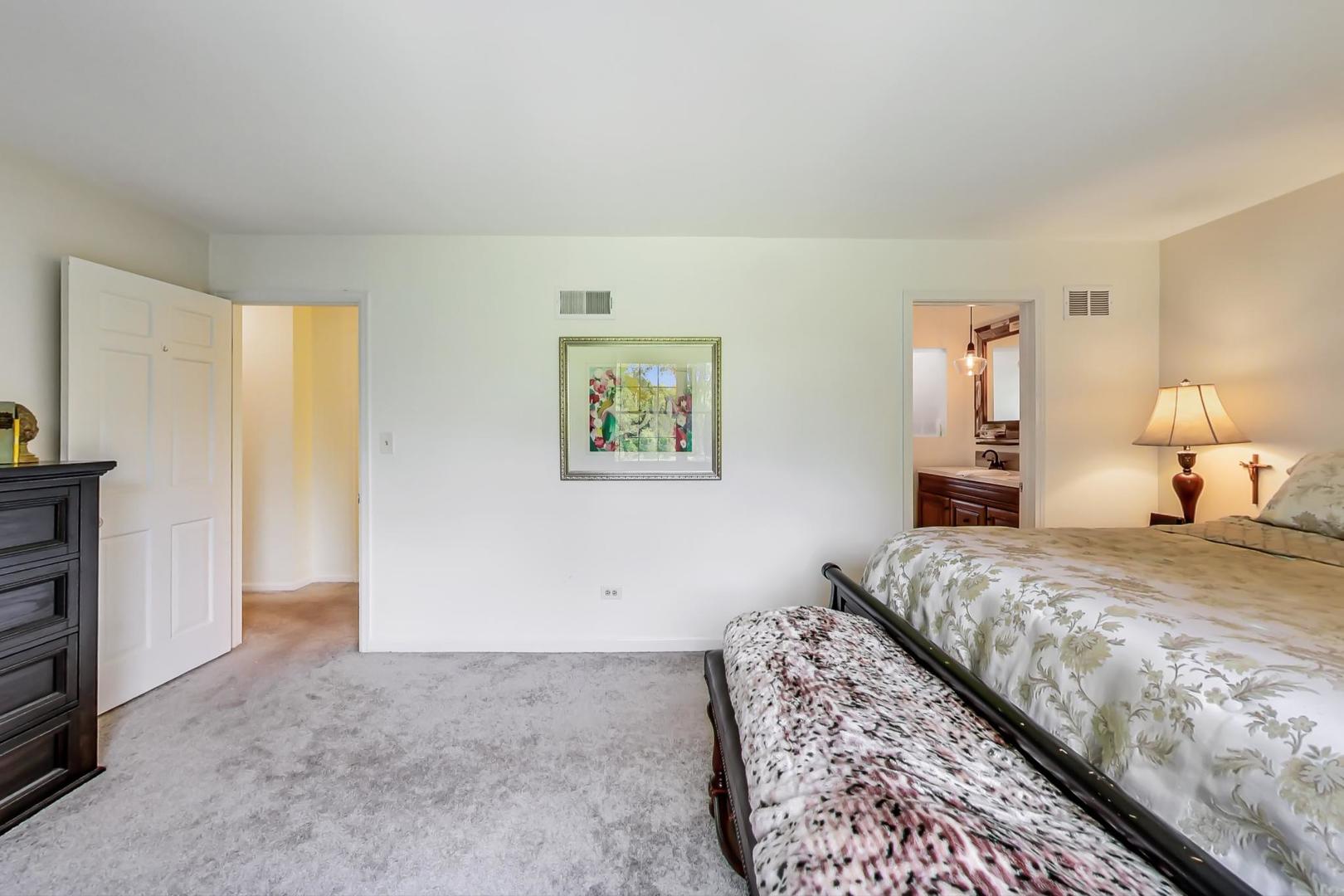 2210 Freeman Court Inverness, IL 60067 - Photo 25 of 56 a bedroom with a bed and a painting on the wall